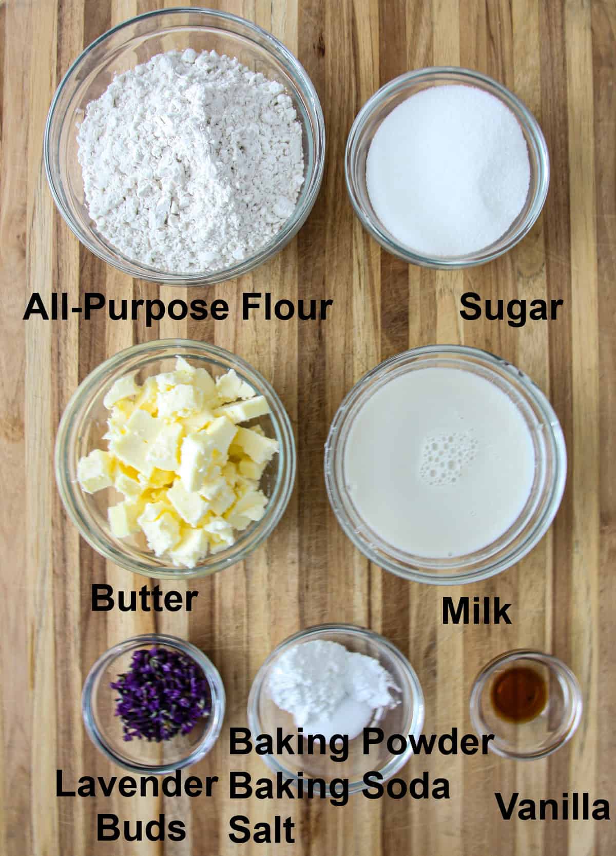 The ingredients to make this recipe in glass bowls on a wooden board.