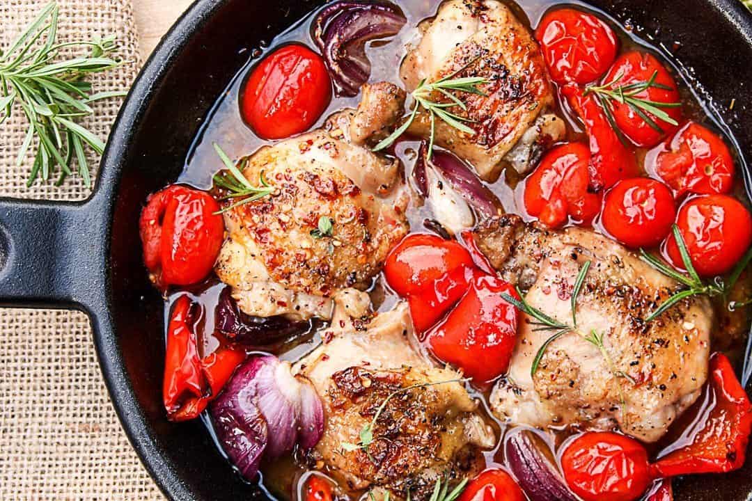 Chicken being cooked in a skillet