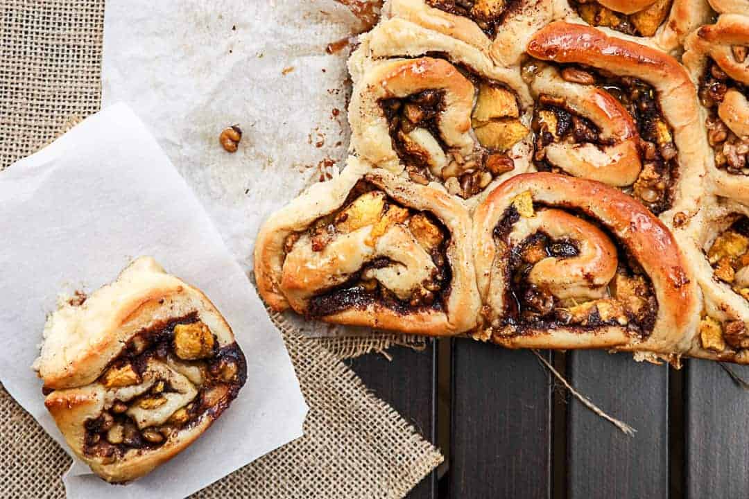 Sweet rolls on parchment paper on a table