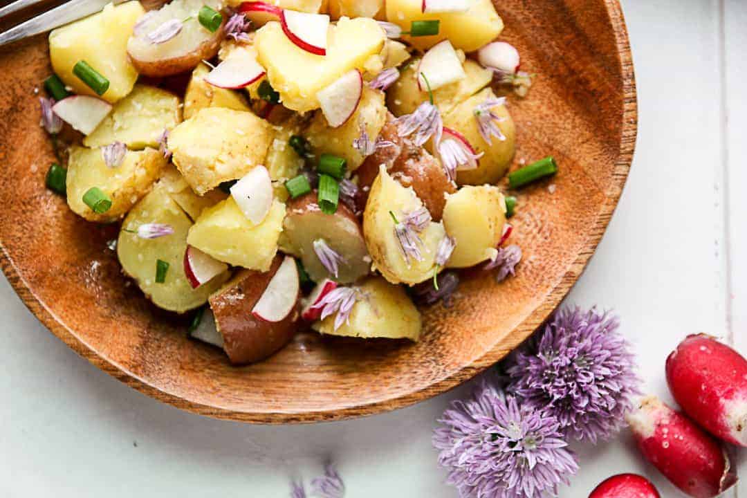 New Potato Salad on a wood plate