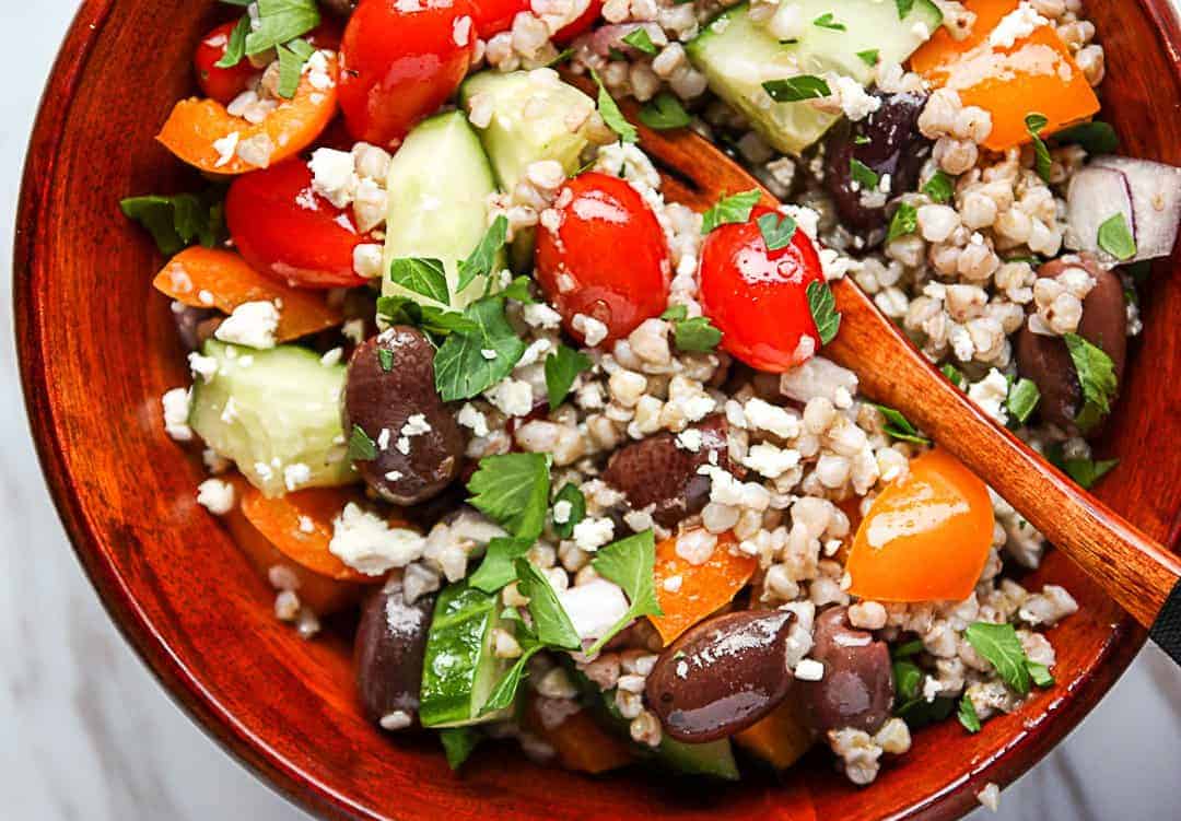 A close up of buckwheat salad with vegetables