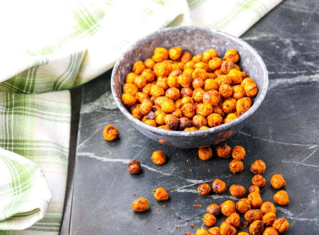 Roasted chickpeas in a bowl on a countertop