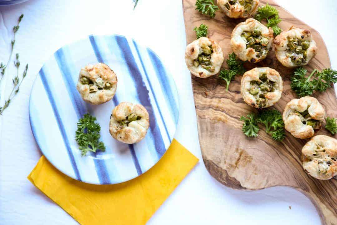 Puff pastry appetizers on a wooden board