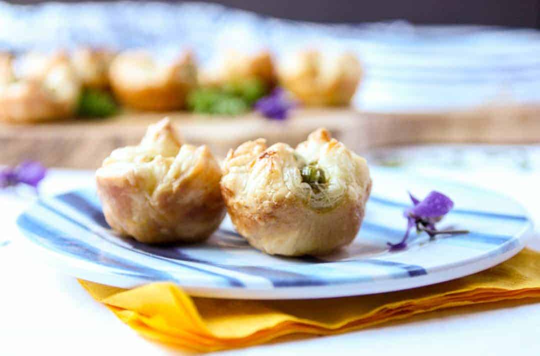 A close up of two appetizers on a plate