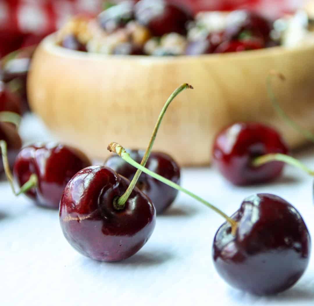 A close up of cherries on a table