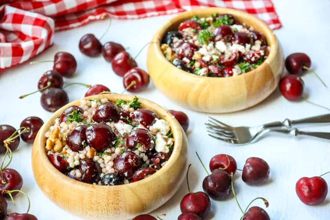 Two wooden bowls full of salad