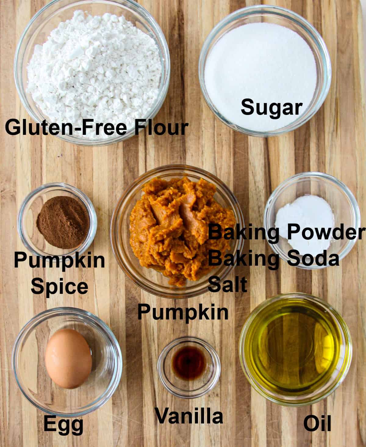 The ingredients for this recipe in glass bowls on a wooden board.