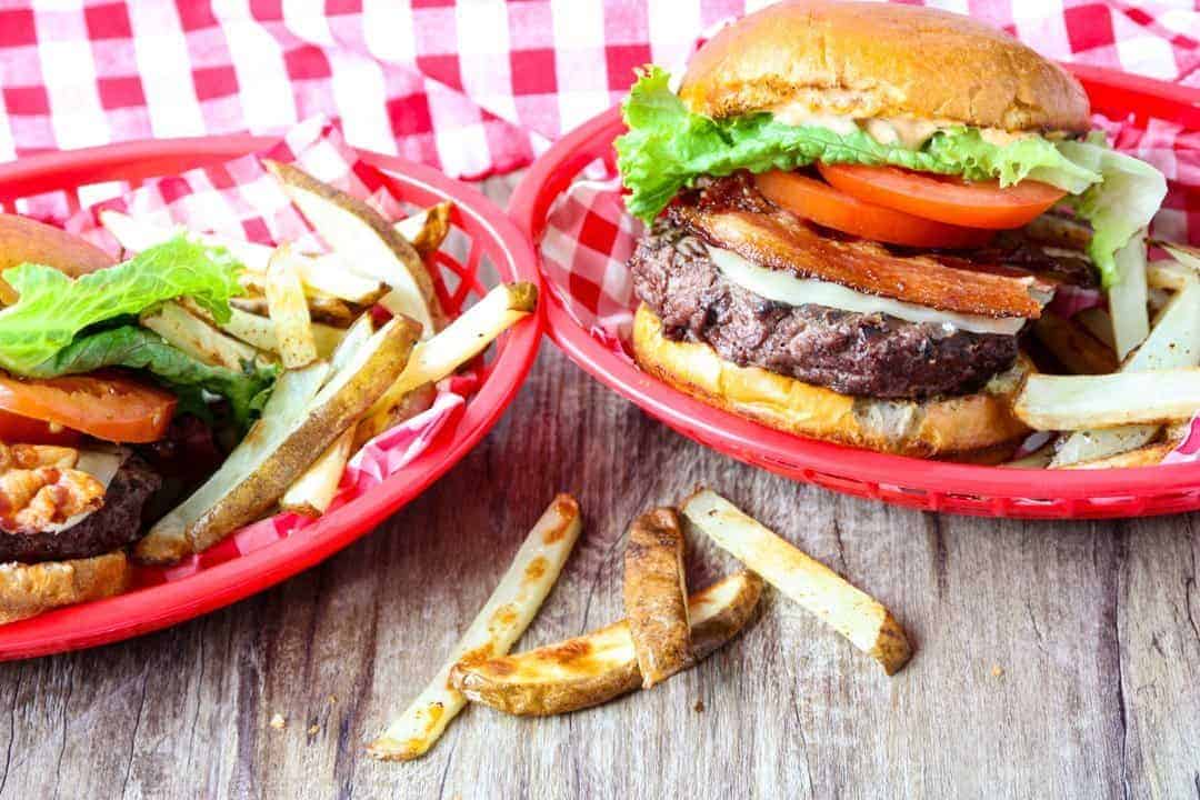 A hamburger sitting on top of a wooden table