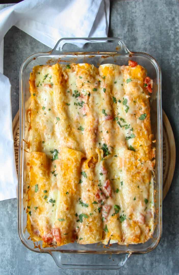 Baking dish of seafood enchiladas