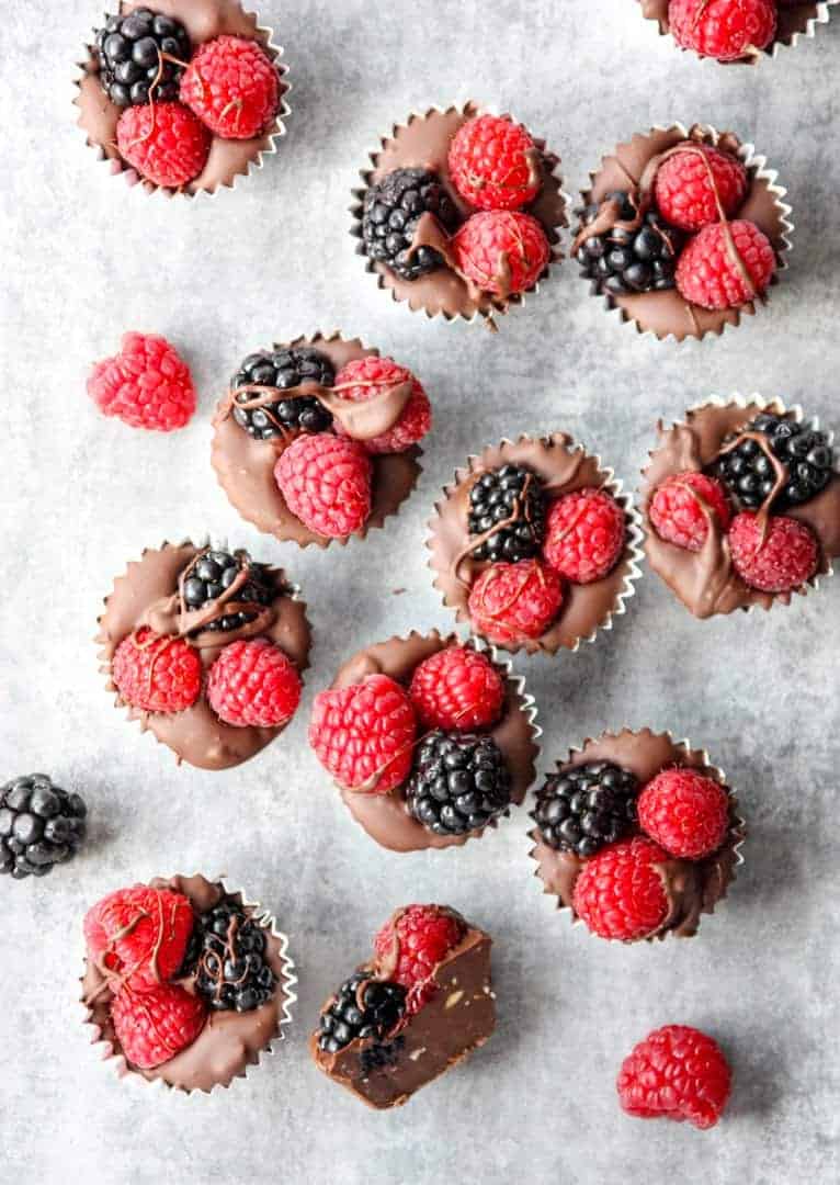 Chocolate and Berries in foil cups on a table