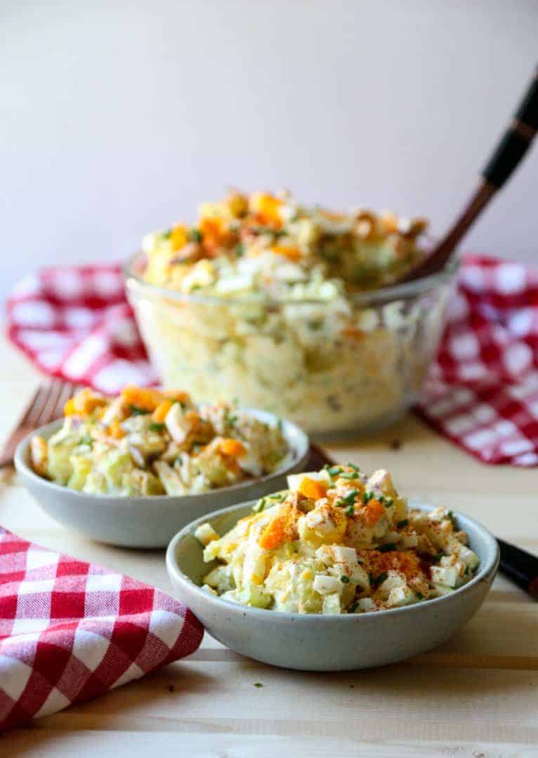 two bowls of salad on a table