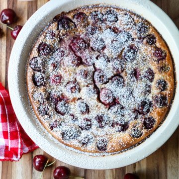Cherry Almond Clafoutis in a white pie plate