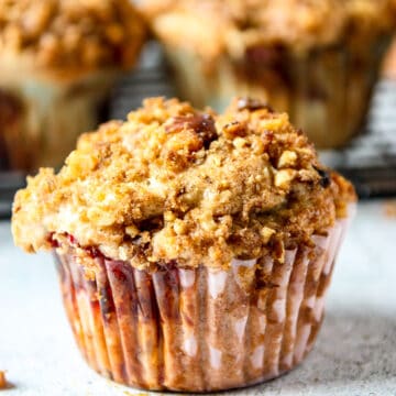 A strawberry rhubarb muffin with a streusel topping.