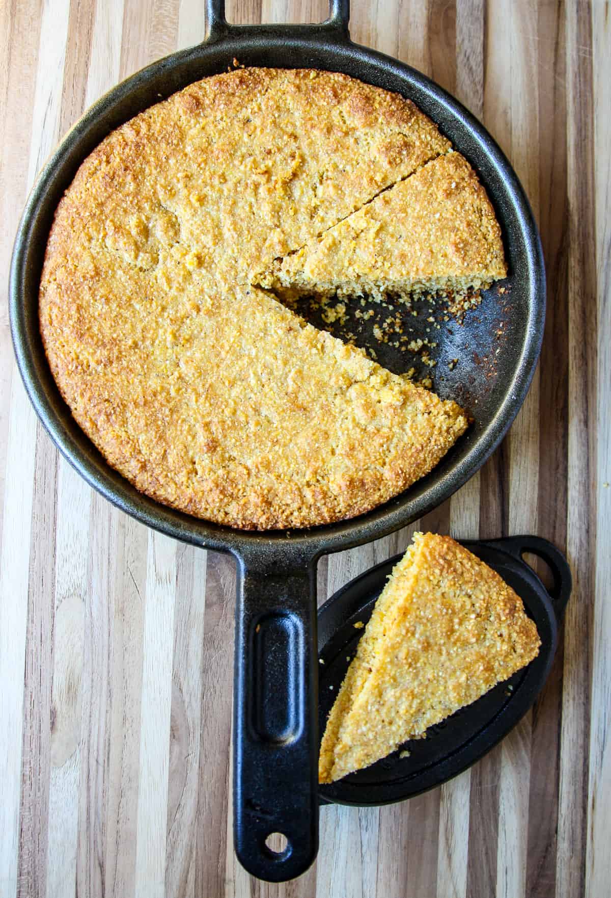 A slice of gluten free cornbread cut from the pan.