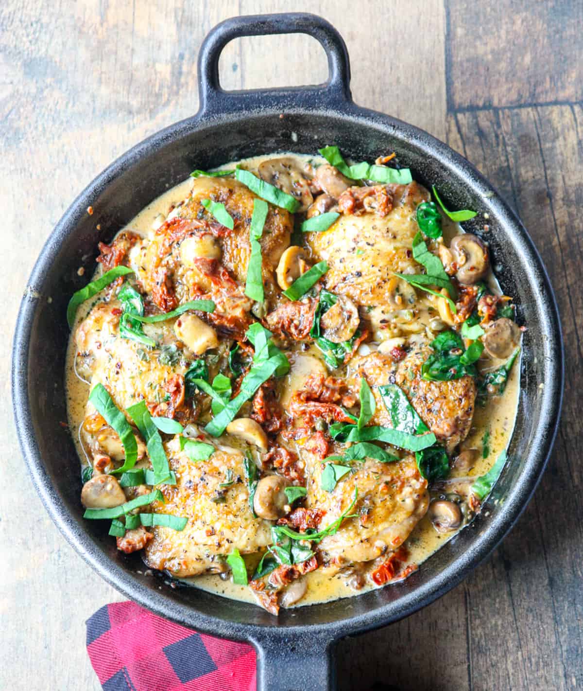 The finished marry me chicken recipe in a cast iron skillet.