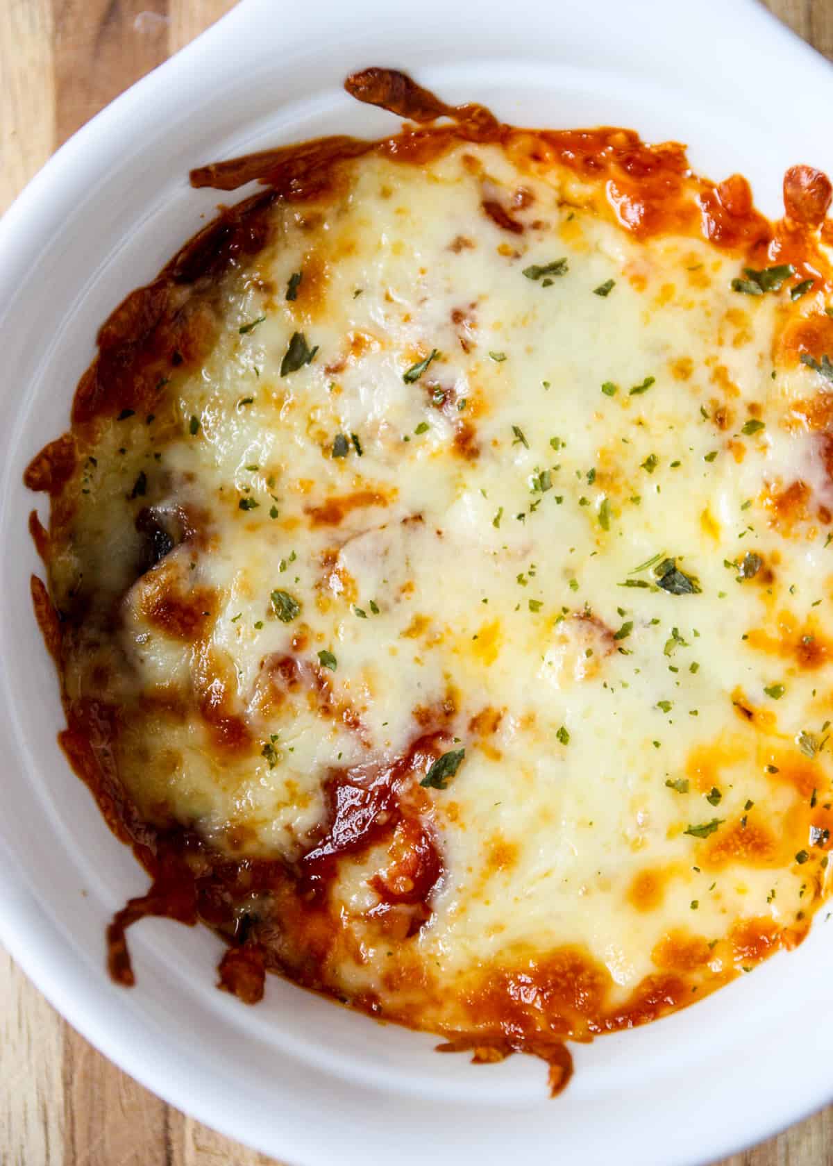 A close up of a baked pizza bowl.