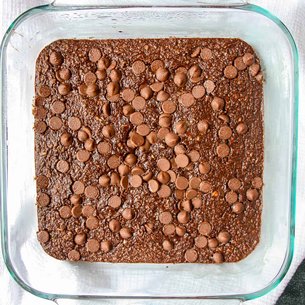 Chocolate Baked Oats in a square glass baking dish.