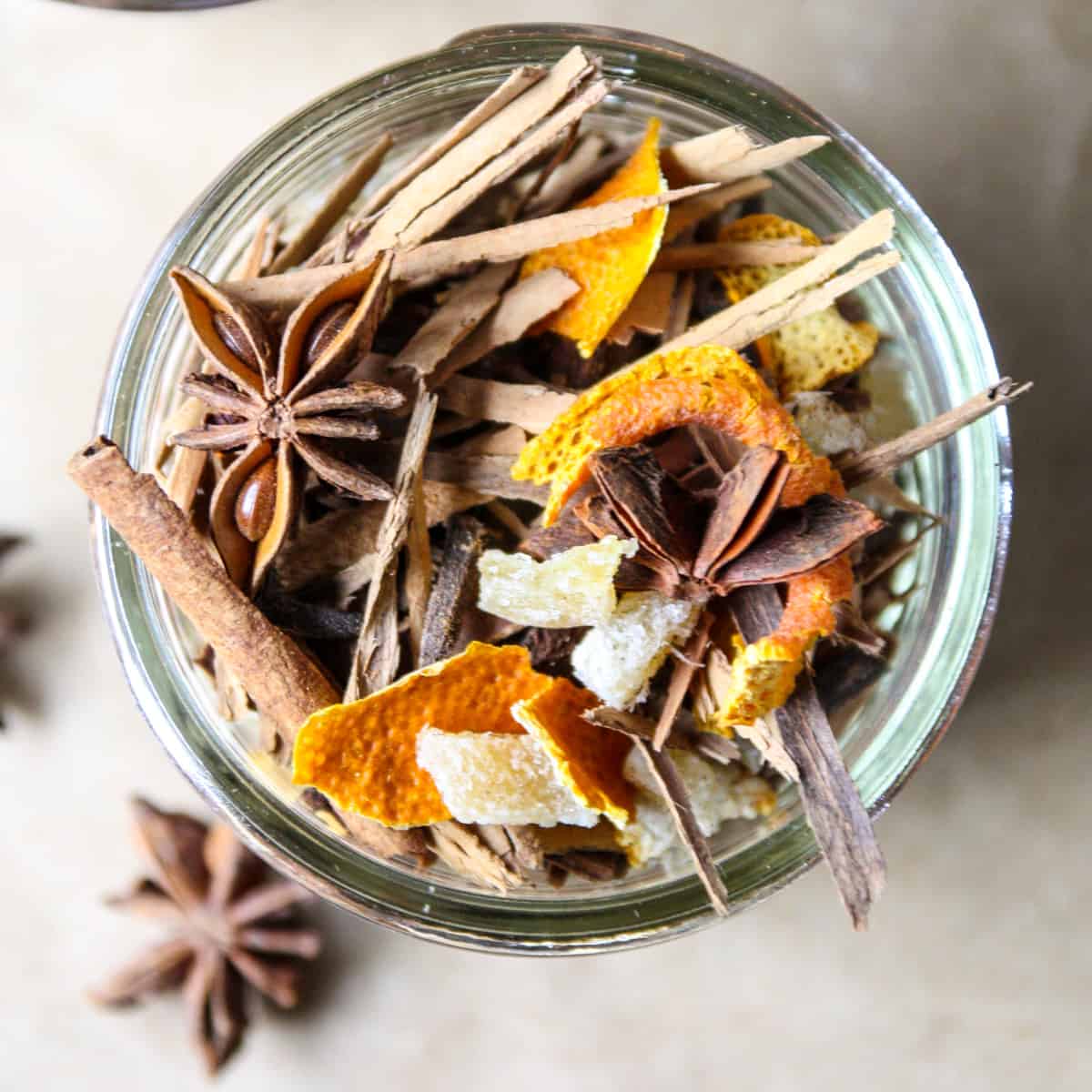 Homemade mulling spices in a glass jar.