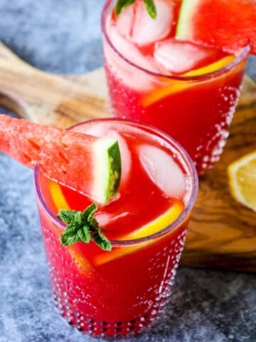 Two vodka watermelon cocktails in clear glasses.