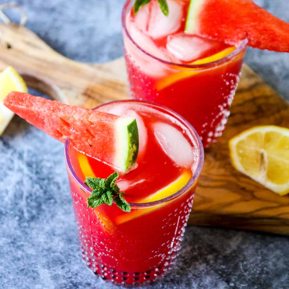 Two vodka watermelon cocktails in clear glasses.