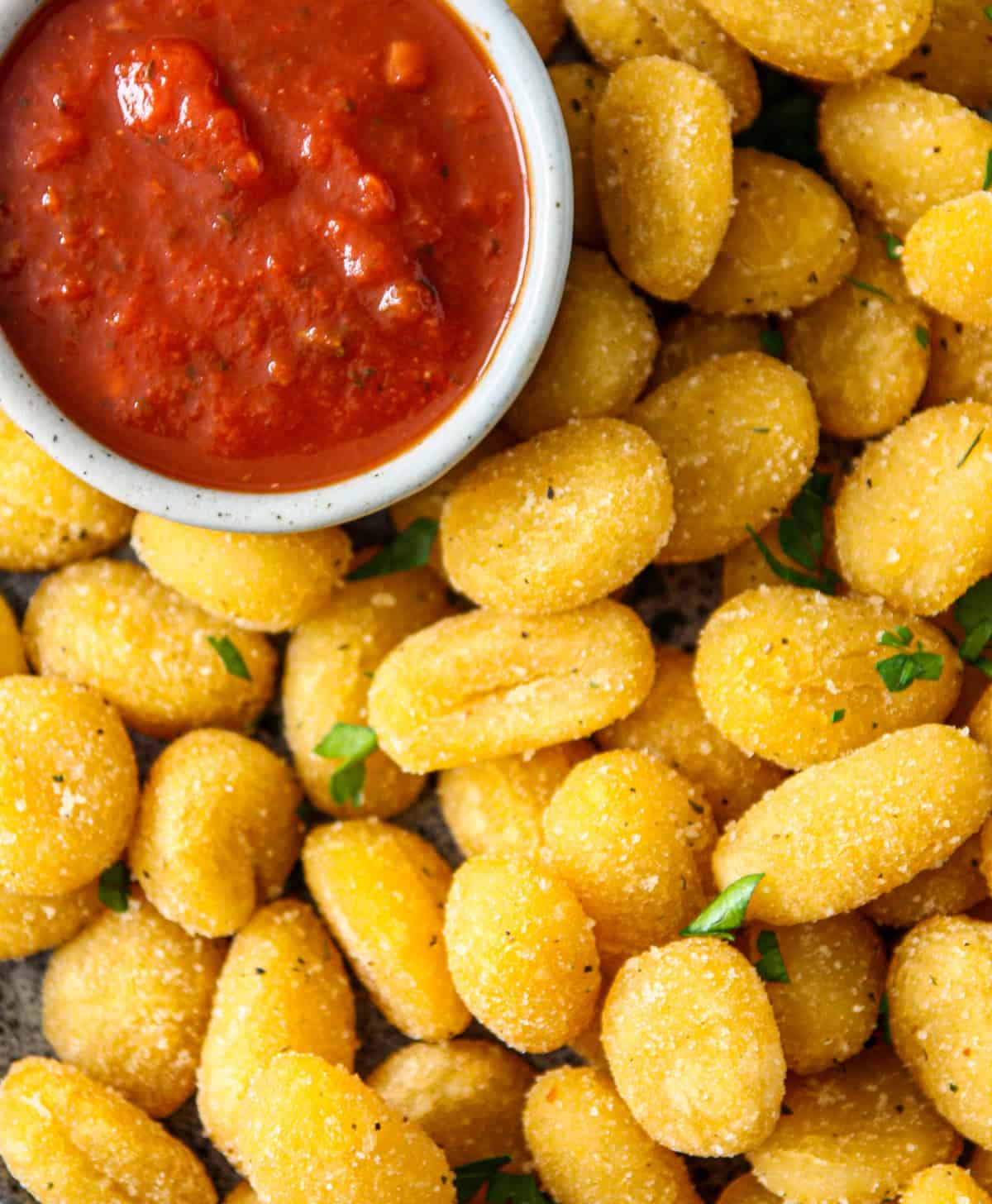 A shot taken from directly above of gnocchi in an air fryer.