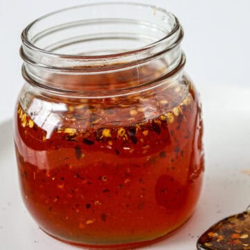 Hot honey sauce in a glass bottle.