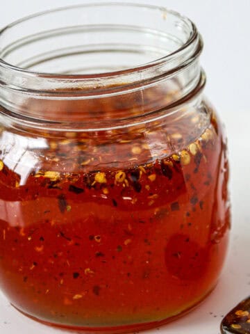 Hot honey sauce in a glass jar.