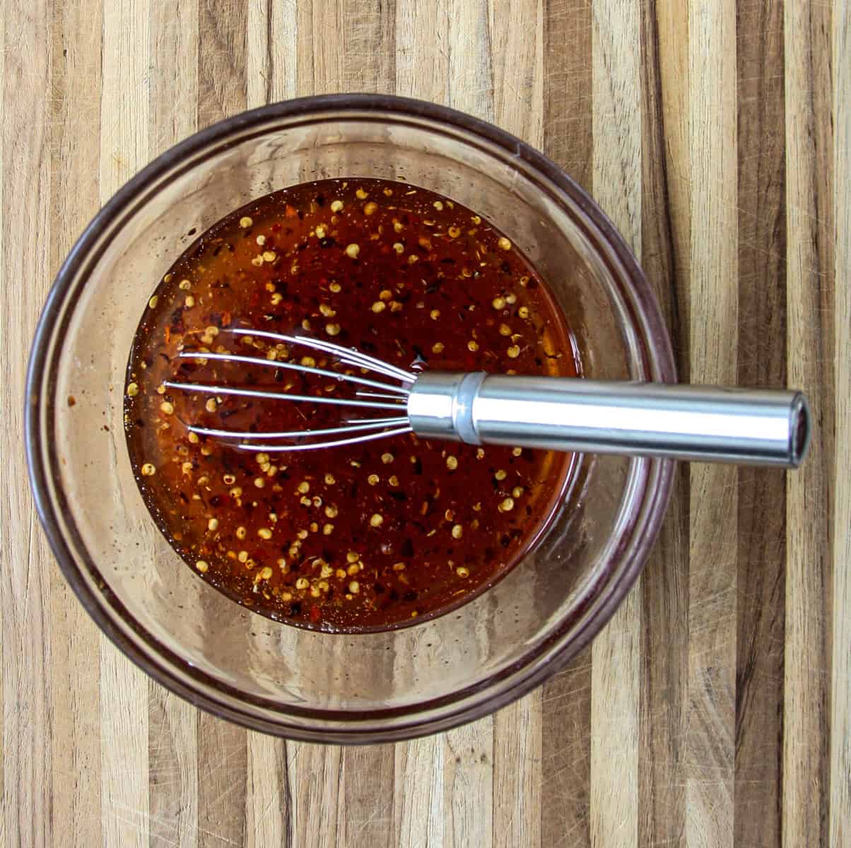 Combine hot honey recipe ingredients in a glass bowl fitted with a wire whisk.